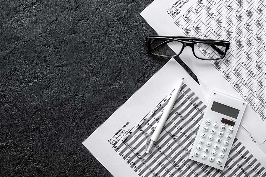 accountant-papers-calculator-and-glasses